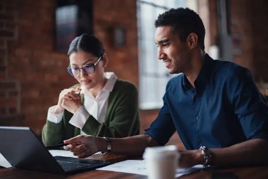 Two professionals collaborating on a project